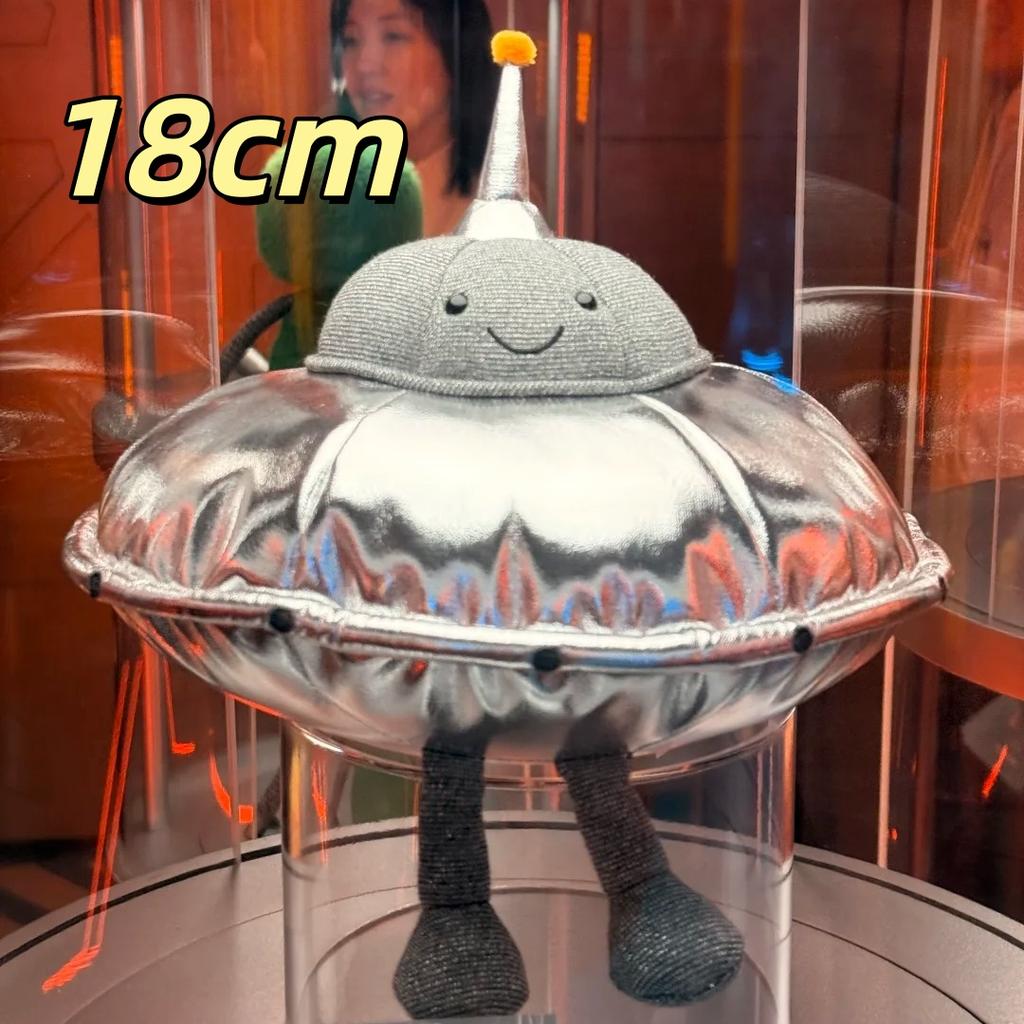 Peluche Espace Mignonne Alien Vert Souriant Soucoupe Volante Argentée Poupées Extraterrestres Douces Remplies Cadeau Adorable pour Fans de Science-Fiction Décoration de Maison