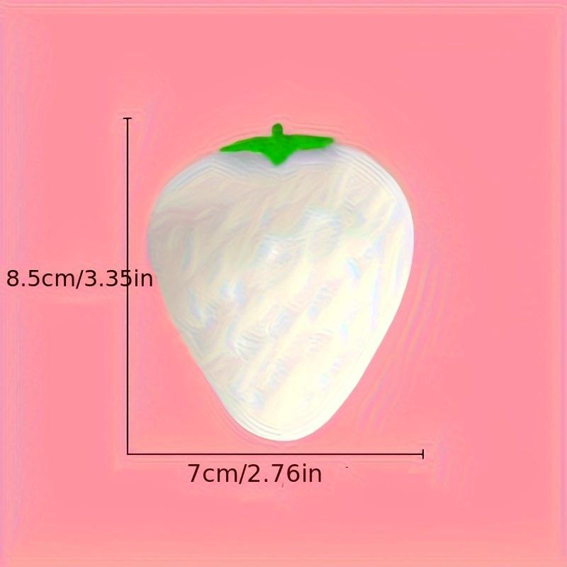 1 Simulated Color Changing Strawberry Toy, A Stress Relief Toy That Changes Color In The Sunlight, and A Decompression Rebound