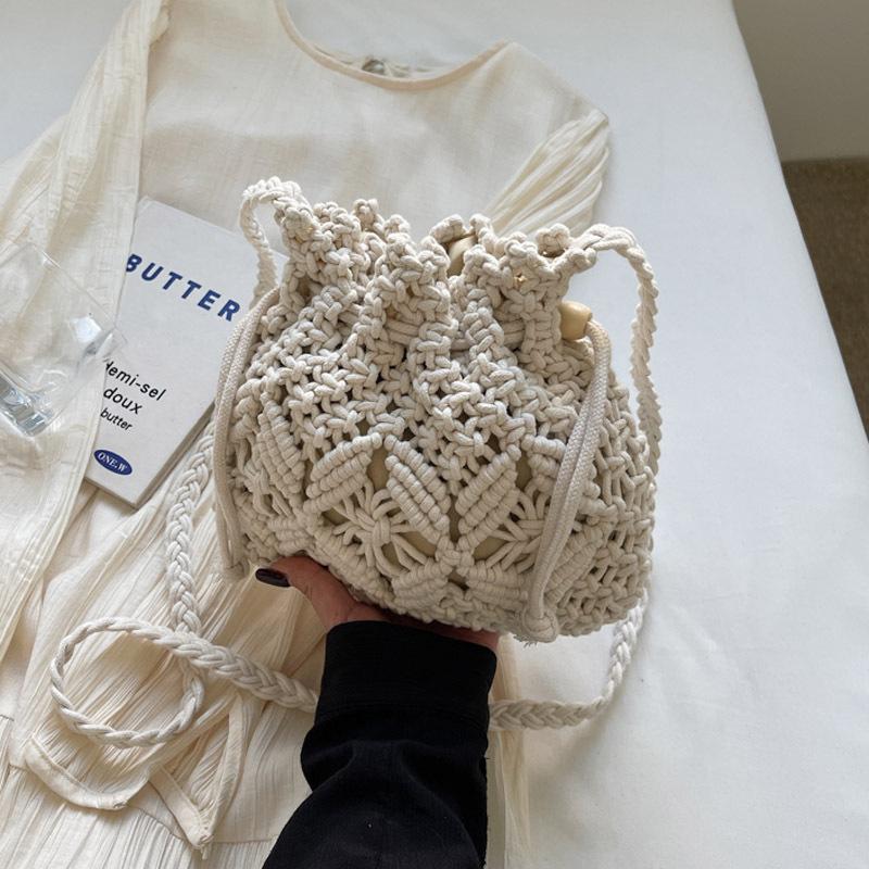 Woven straw bag women's summer versatile 2026 new fashion niche design crossbody bucket bag seaside beach bag