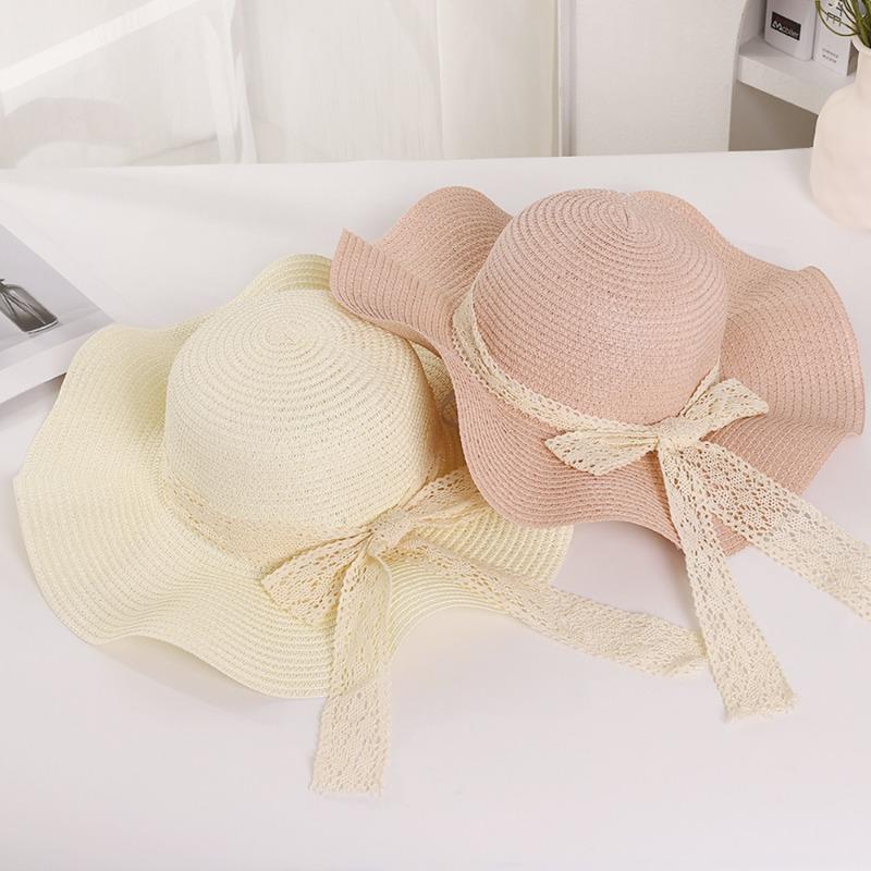 Summer wavy edge bow streamer straw hat seaside outing idyllic sunshade sun protection UV protection sun hat
