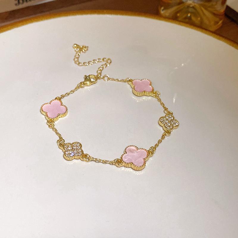 

Gold-Plated Zircon & Mother-of-Pearl Flower Bracelet - Elegant Hand Jewelry for Women