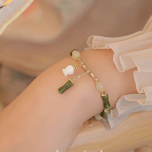 Bambusglocken-Orchideen-Armband, Damenmode-Design, fortschrittlicher Sinn für Mode, leichter Luxus, antiker Stil, Accessoires-Armband