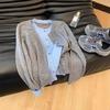 Early autumn new fake two pieces contrasting colors thin temperament knitted cardigan thin top women's long-sleeved design sense niche