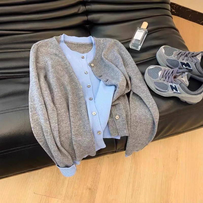 Early autumn new fake two pieces contrasting colors thin temperament knitted cardigan thin top women's long-sleeved design sense niche