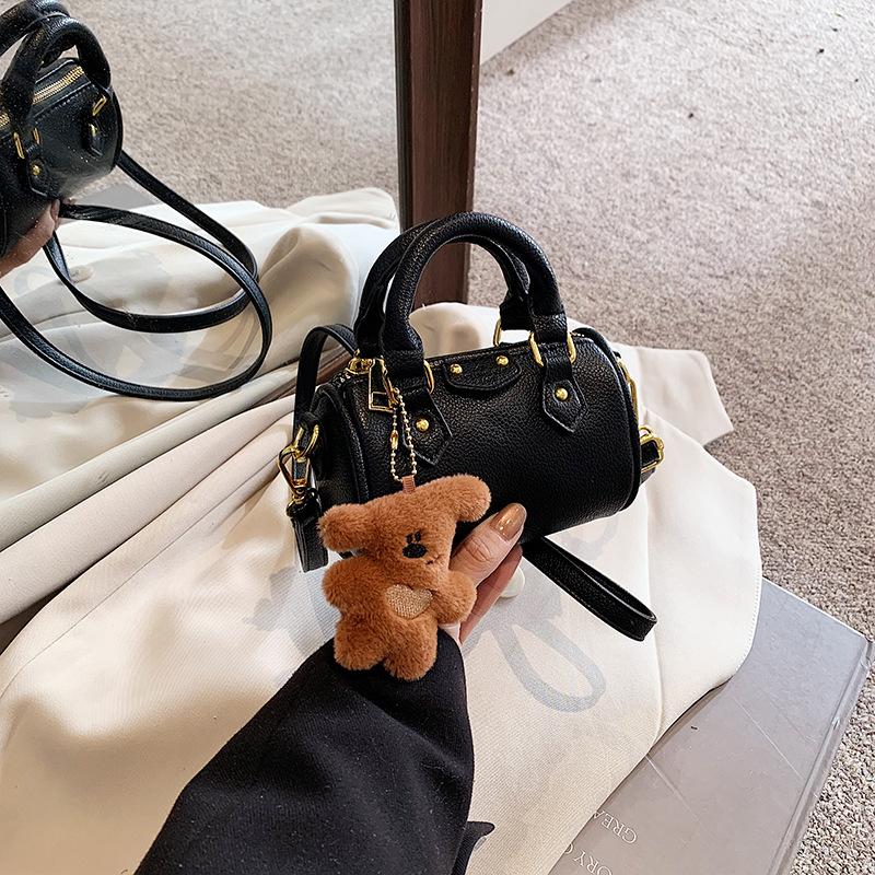 Handtasche mit modischen Kontrastfarben, Stilvolle und trendige Mini-Baby-Rundtasche, Kinder-Kissenbeutel With pendant schwarz