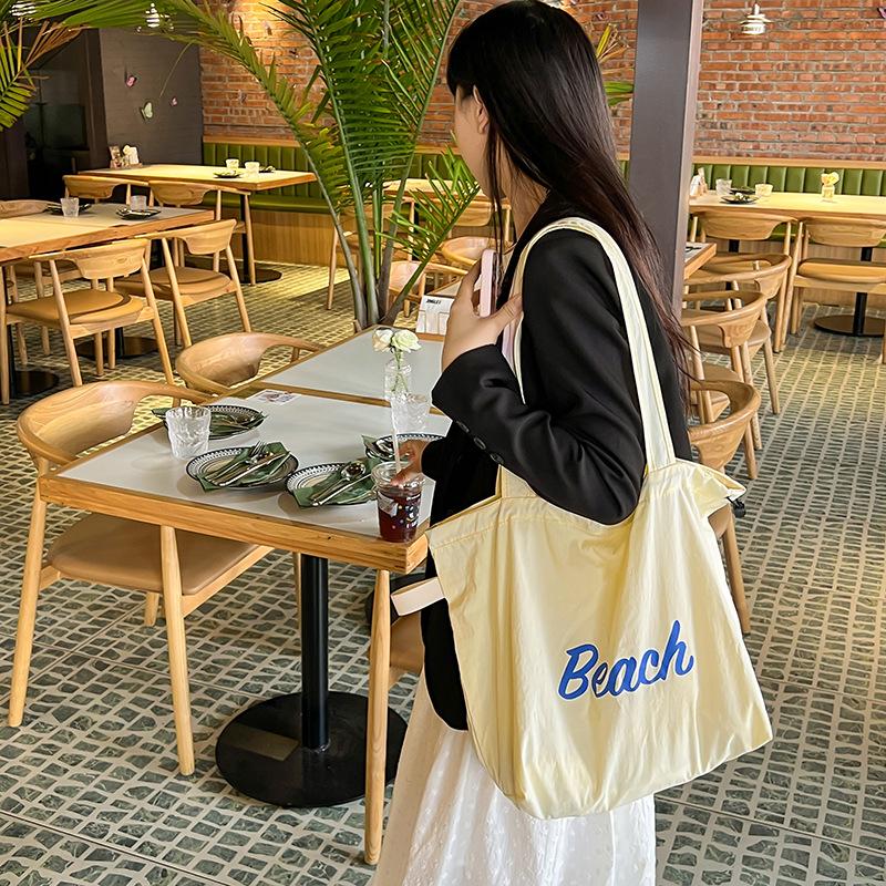 Korean Version of the New Letter Printing Bag Women's Large-capacity Nylon Shoulder Bag Casual Fashion Portable Drawstring Tote Bag