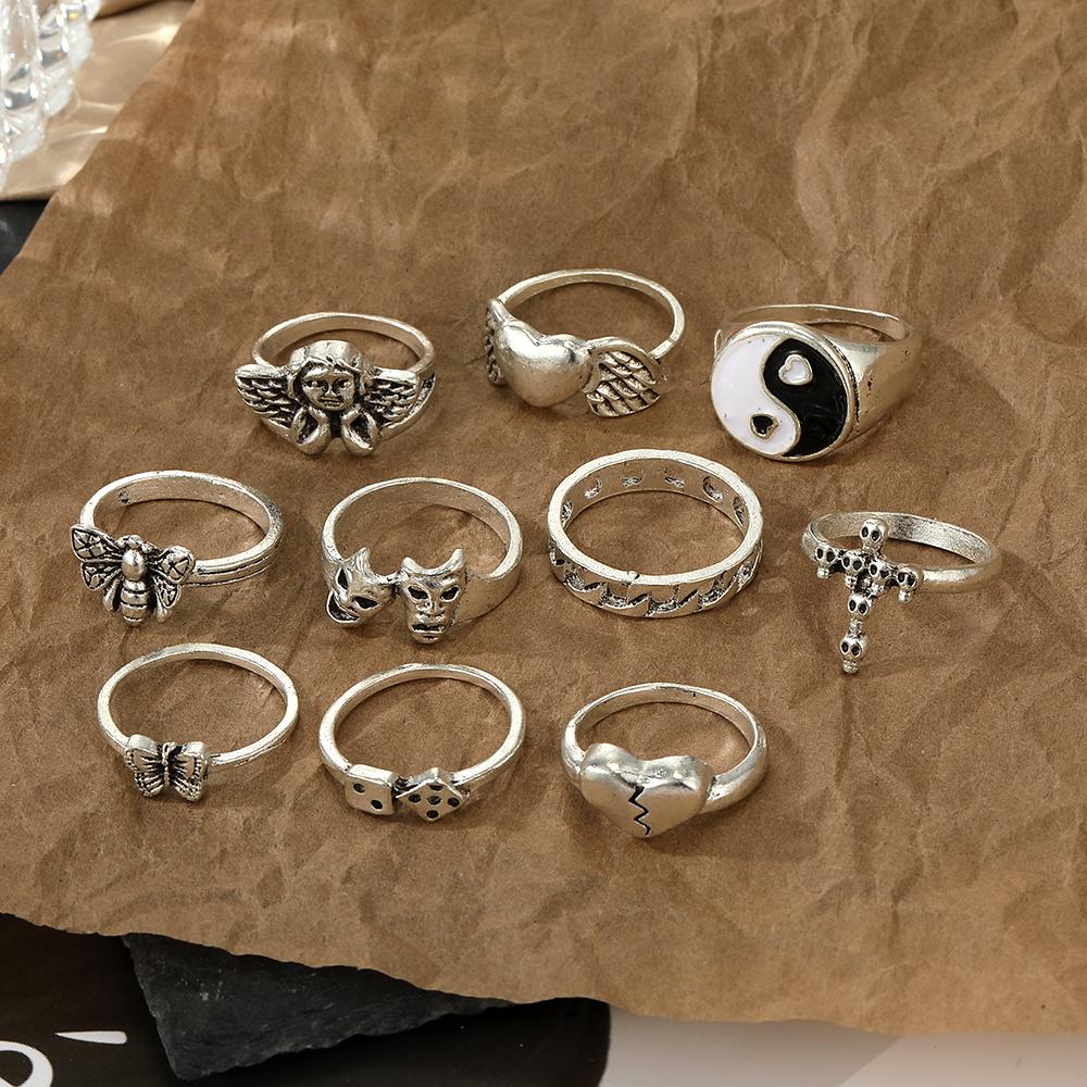 Set di anelli di gioielli intagliati con croce di scheletro di Tai Chi con farfalla di angelo dell'amore da 10 pezzi