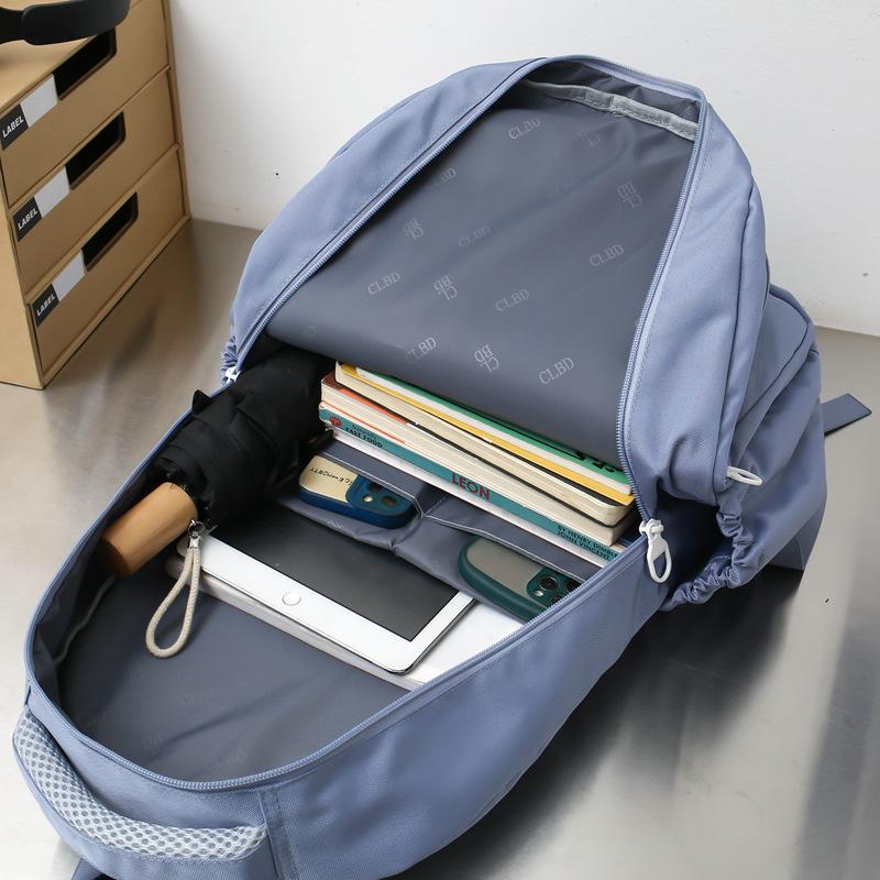 New student schoolbag, girls' large-capacity weight reduction, light solid color simple junior high school backpack