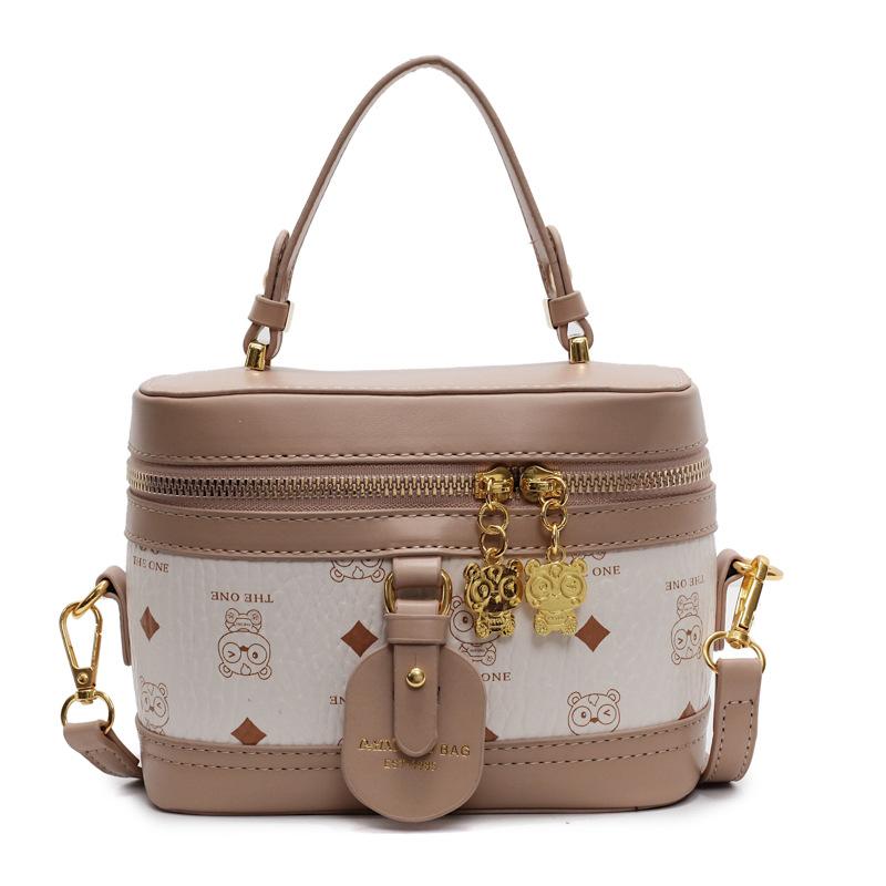 

Fashion printed cartoon cute bear bucket bag women s new spring and summer cosmetic bag shoulder messenger bag