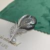 Gold-Plated Zircon Shell Feather Brooch with Pearl Accent