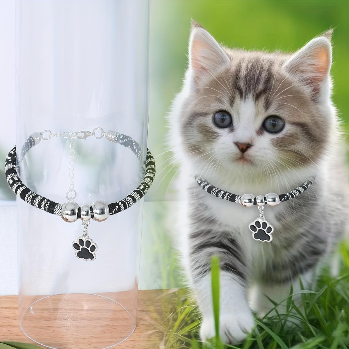 

Нейлоновое ожерелье для питомца с разноцветным кулоном в виде лапы, регулируемый ошейник для кошек и маленьких собак с этническим дизайном - стильный аксессуар для питомца one-size чёрный