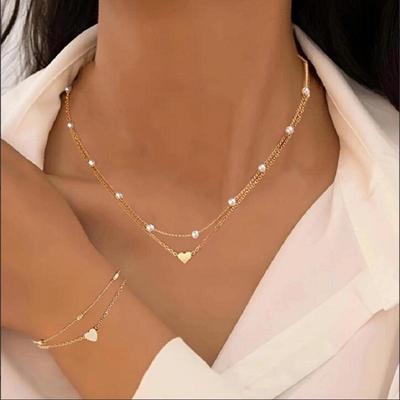 Set Bracciale e Collana Cuore Perla a Doppio Strato - Gioielli di Moda Versatili