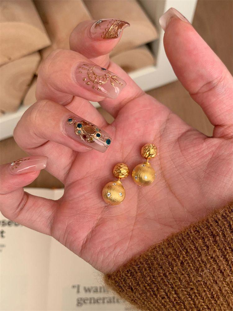 Gold Brushed Starburst Ball Stud Earrings: Versatile, Light Luxury Design for Women.