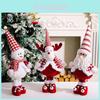 Charming Red And White Striped Christmas Santa Doll With A Cozy Fabric Design