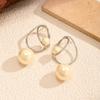 New winding circle large pearl earrings European and American temperament stud earrings niche retro light luxury high-end earrings