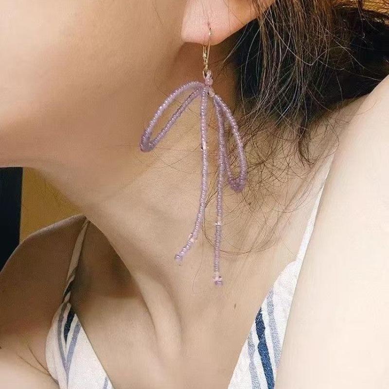 

New super fairy purple bow Yuxing rice bead earrings handmade high value cold temperament earrings women