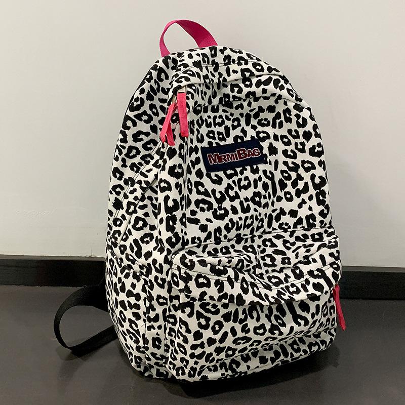 

Детский школьный рюкзак для девочки начальной школы с коровьим принтом, рюкзак для ученика средней школы, студента колледжа, модный рюкзак цветной печати леопарда