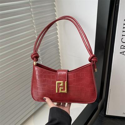 Lente nieuwe gepersonaliseerde baguette tas modetrend niche design dames textuur schouder crossbody tas