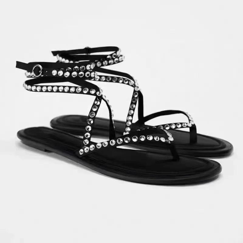 

Новые босоножки на плоской подошве с черными стразами и шнуровкой, с плоским носком и полым дизайном 42