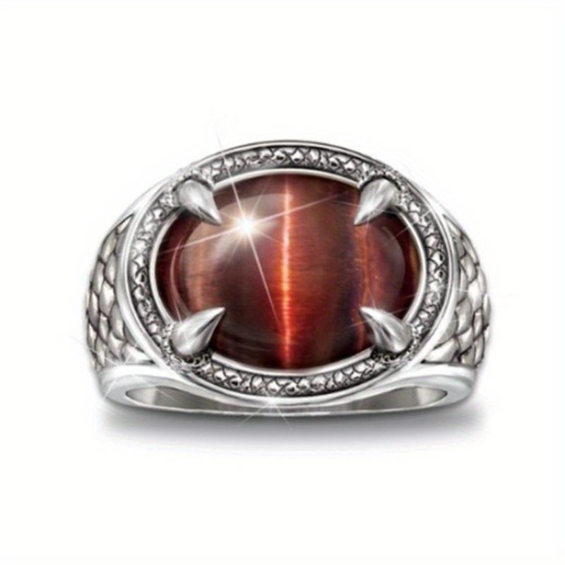 Oval dark stone ring with woven texture. Unique shape, ideal for Western themes—rustic and retro style.