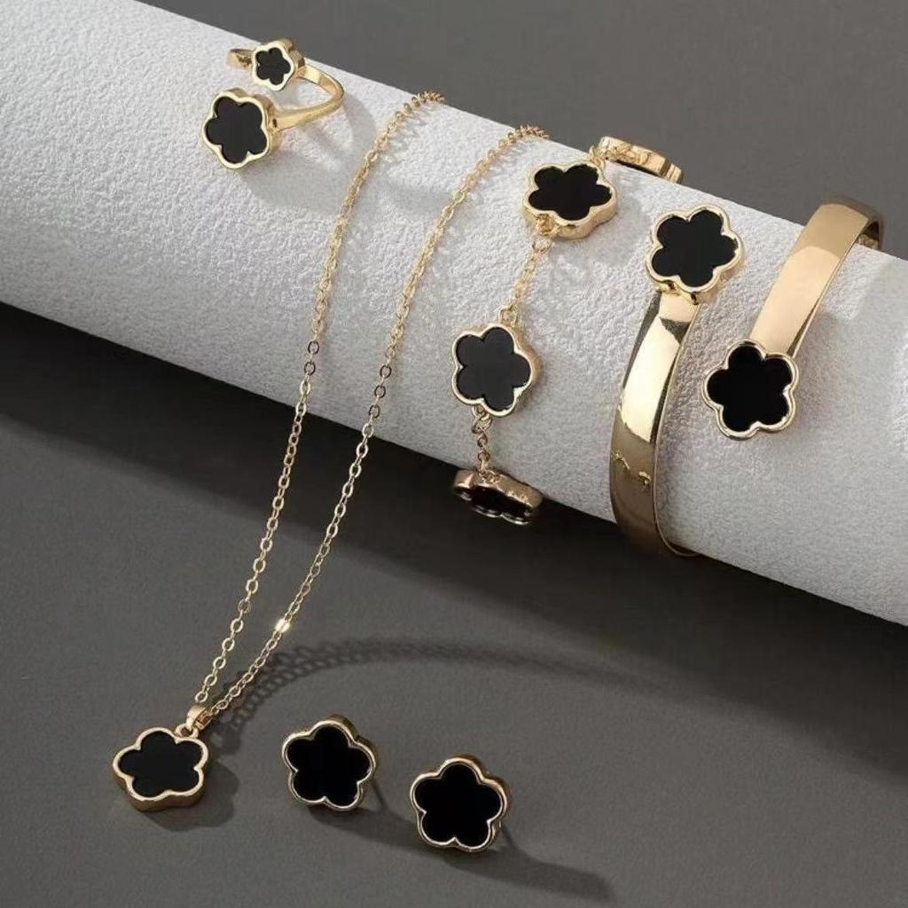 Elegant 5-Piece Flower Jewelry Set: Necklace, Bracelet, Earrings, and Ring.