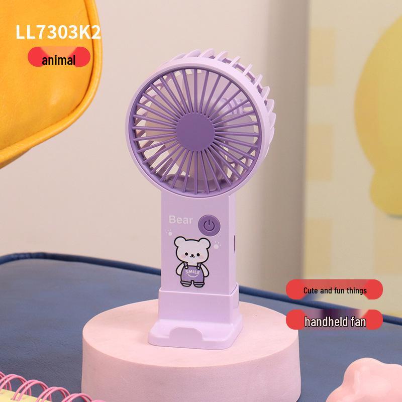 

Cute Cartoon Mini Handheld USB Charging Fan & Portable Phone Holder - Large Wind Power for Office Use Custom/Wholesale/Cross-border