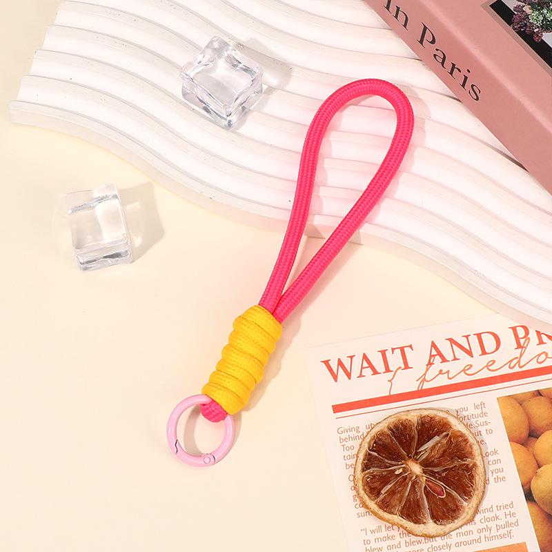 2025 Colorblock Anti-Verlust-Handytasche mit auffälligem geknotetem Handgelenkband