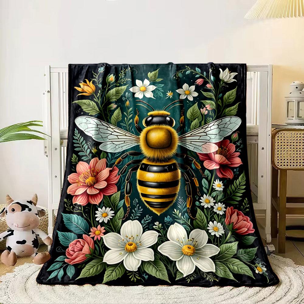 A vibrant bee is surrounded by colorful flowers and lush green leaves. for all seasons blanket lunch break throw gift 80cm x 120cm