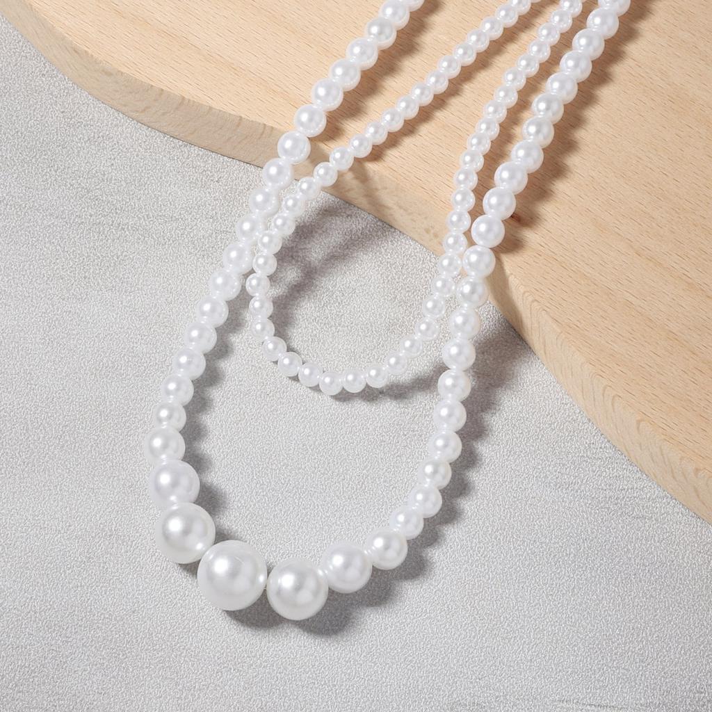 Korean version of temperament sweet casual fashion imitation pearl niche multi-layer design necklace, versatile French retro