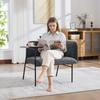Modern single armchair with comfortable fabric backrest and two storage compartments, complemented by a practical side table.