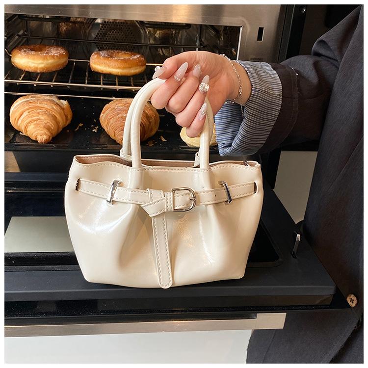 

2025 high-end hand bucket bag spring new simple shoulder bag niche design women s bag белый