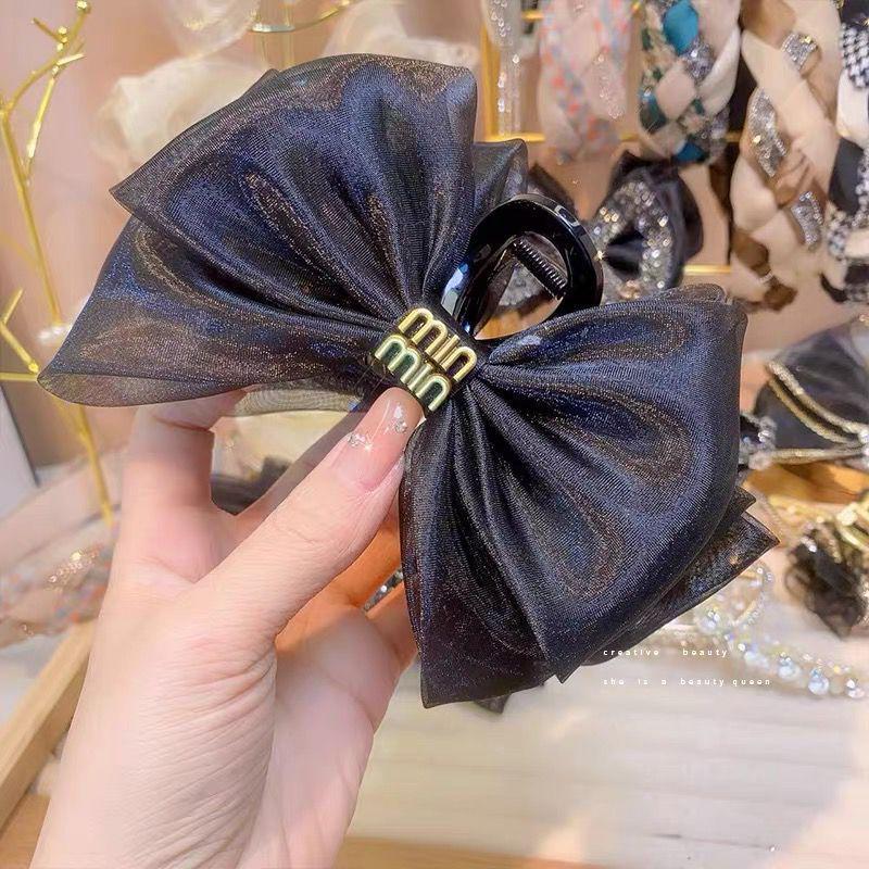 Ostrich Feather Claw Clip: Elegant Updo Accessory for Volume & Style