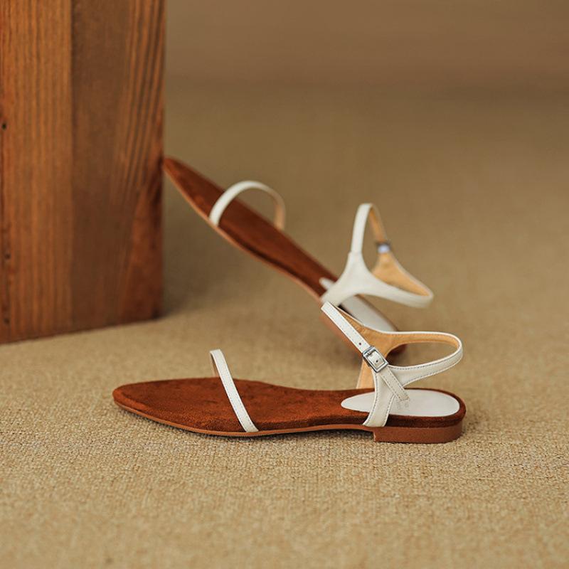 

Новые летние женские пляжные сандалии Корейская версия однотонные сандалии на плоской подошве удобная мягкая подошва из говяжьей кожи большой размер кожа острый носок 40 чёрный