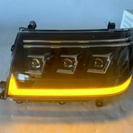 Compatible with Toyota Land Cruiser LC100 1998-2007 Headlight Assembly with LED Daytime Running Lights and Turn Signals.