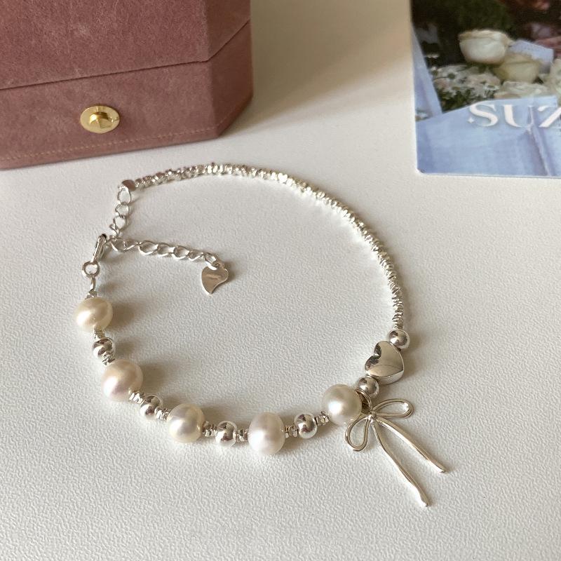 

Корейский браслет-бантик из стерлингового серебра S925 с жемчугом: Изысканная легкая роскошь, универсальные модные украшения высокого класса для женщин