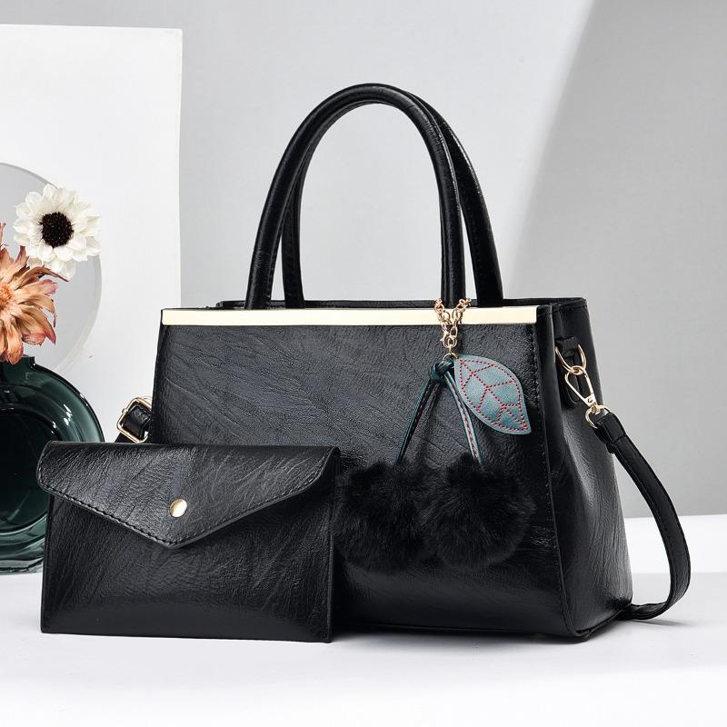 Einfache Elegante Damenhandtasche und Geldbörsen Neue Große Kapazität Fellbommel Anhänger Schultertasche High End Damen Umhängetaschen