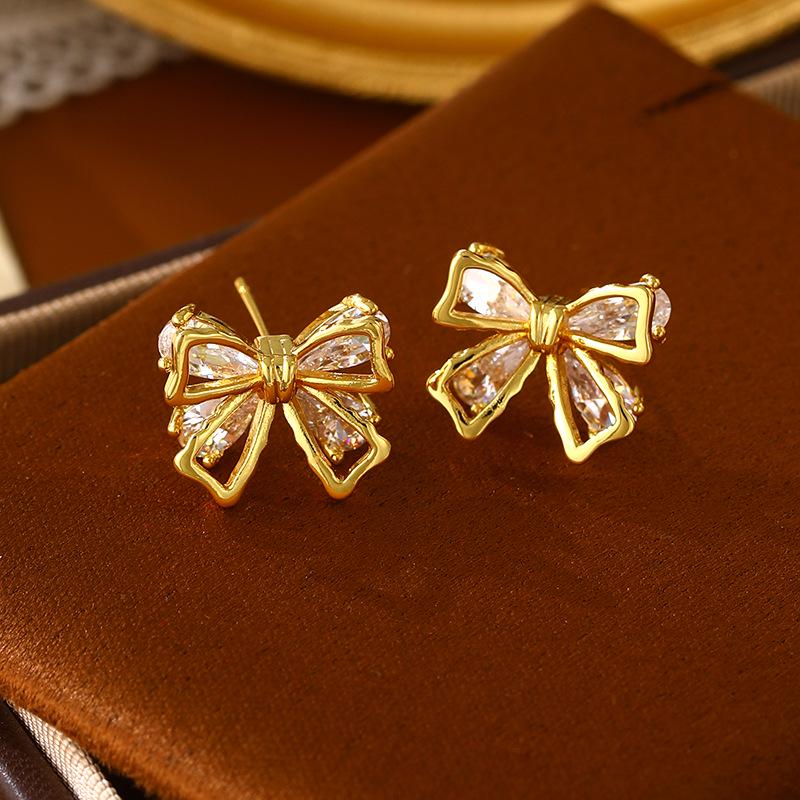 Elegant Gold-Plated Zirconia Bow Stud Earrings - High-End Fashionable Design for Women