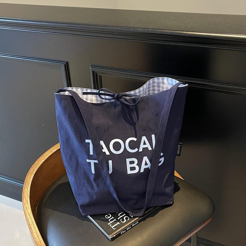 Lazy and lightweight cloth bag, tote bag, niche literary and artistic large-capacity shoulder bag, double-sided usable messenger bag.