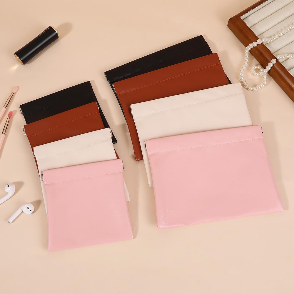 Auto-Close PU Leather Cosmetic Bag for Travel - Holds Lipstick, Earphones, Chargers, and Cables.