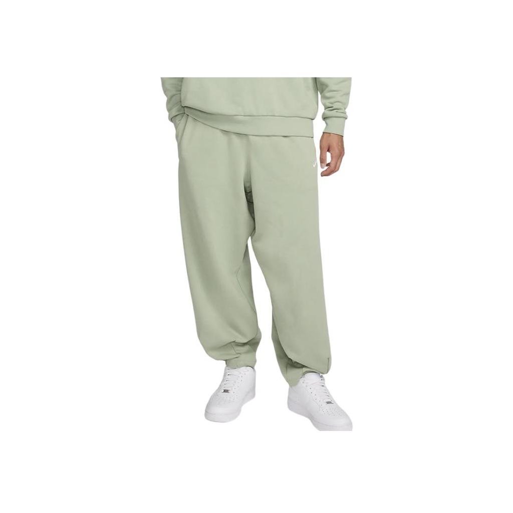 Nike Pantaloni Sportivi in Pile a Tinta Unita con Polsini Lavorazione Larga Uomo Fondo Verde HJ1823-370