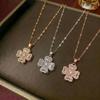 Women's Necklace: Four-Petal Flower Collarbone Chain with Rotating Rhinestone Pendant and Zirconia Jewelry.