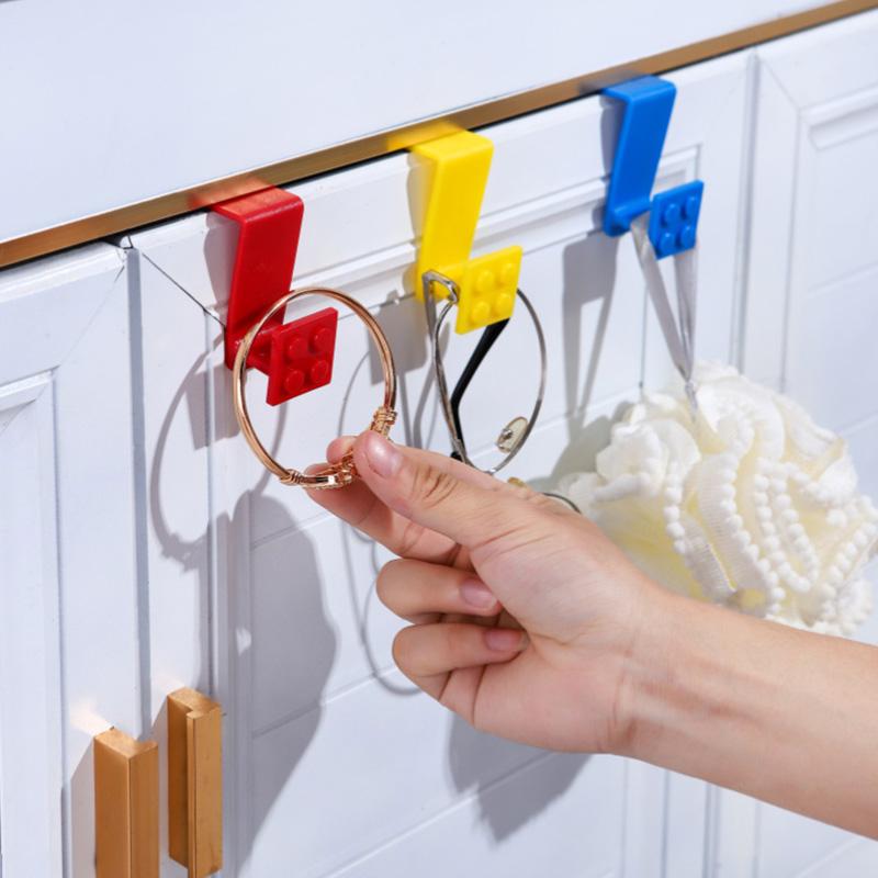 Baustein Cartoon Haken zum Aufhängen von Müllbeuteln Plastiktüten an Schranktüren Einfache Installation Heimküchenorganisation Mehrzweck-Nutzhänger