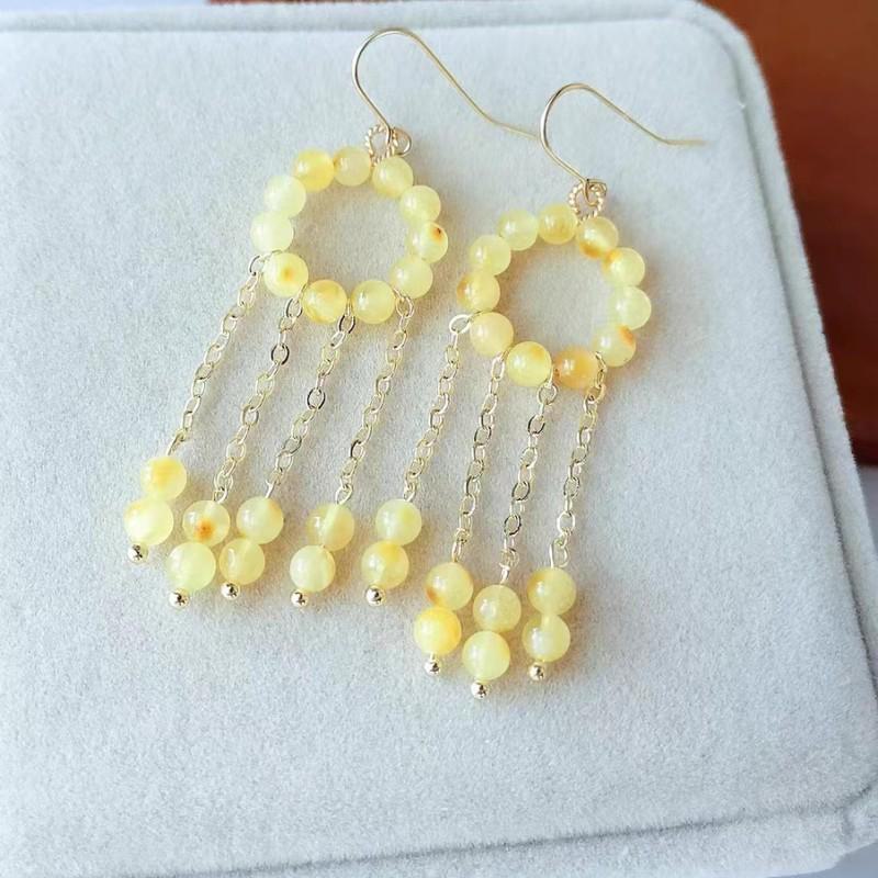 Chinese Jade Moon Tassel Earrings: Unique Design & Elegant Trend