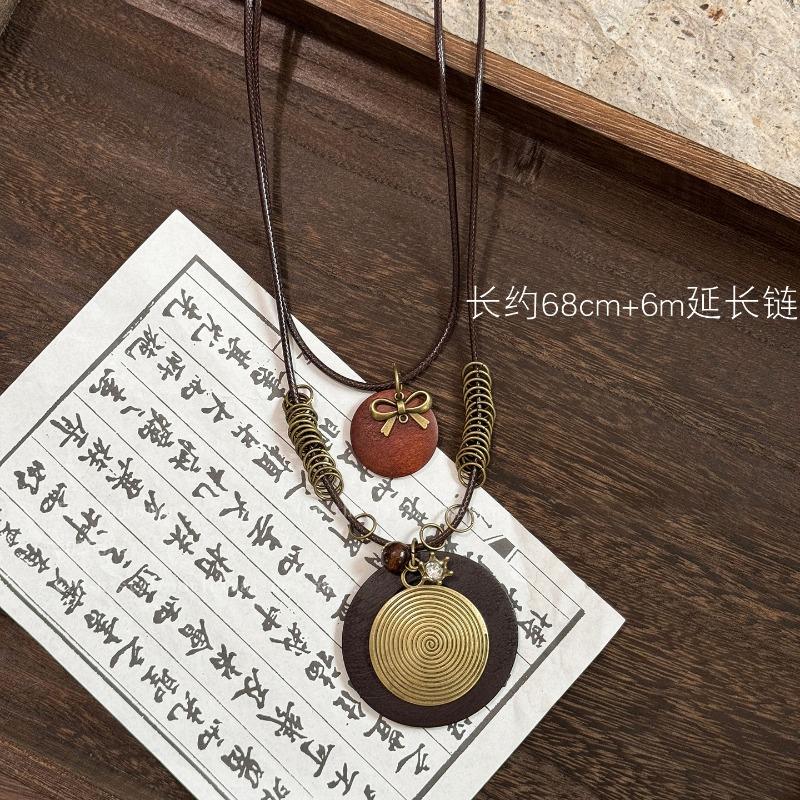 Bohemian wood beads beaded hollow round pendant necklace light luxury high-end sweater chain niche necklace accessories