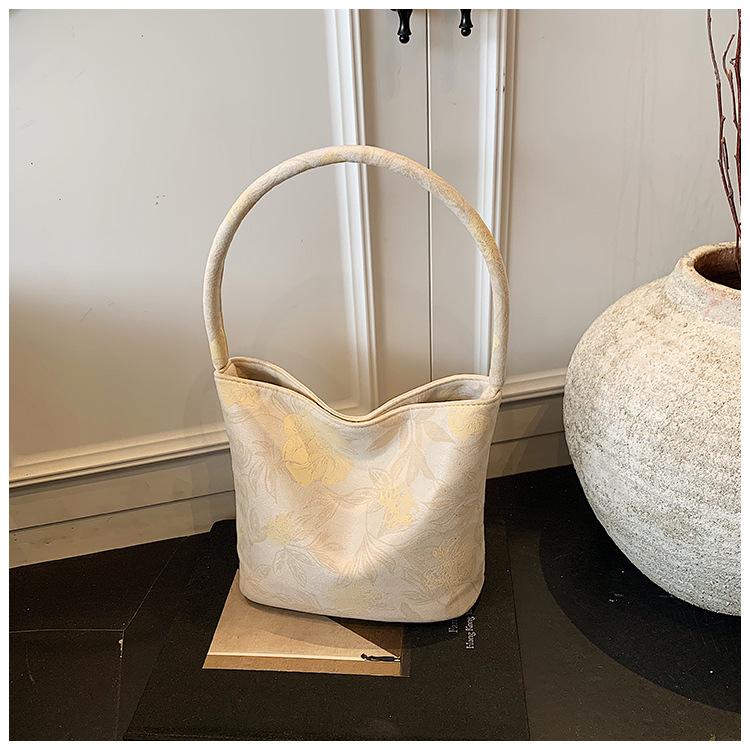 

Популярная маленькая сумка женская 2025 новая модная сумка-ведро простая сумка подмышку бежевый