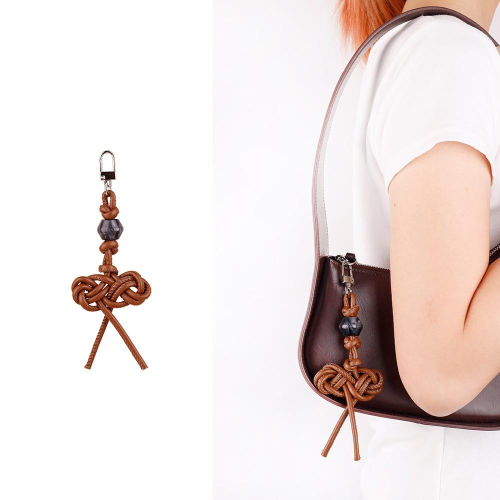 MIU series creative color hand-woven ruyi knot pu leather cord accessories bag pendant keychain