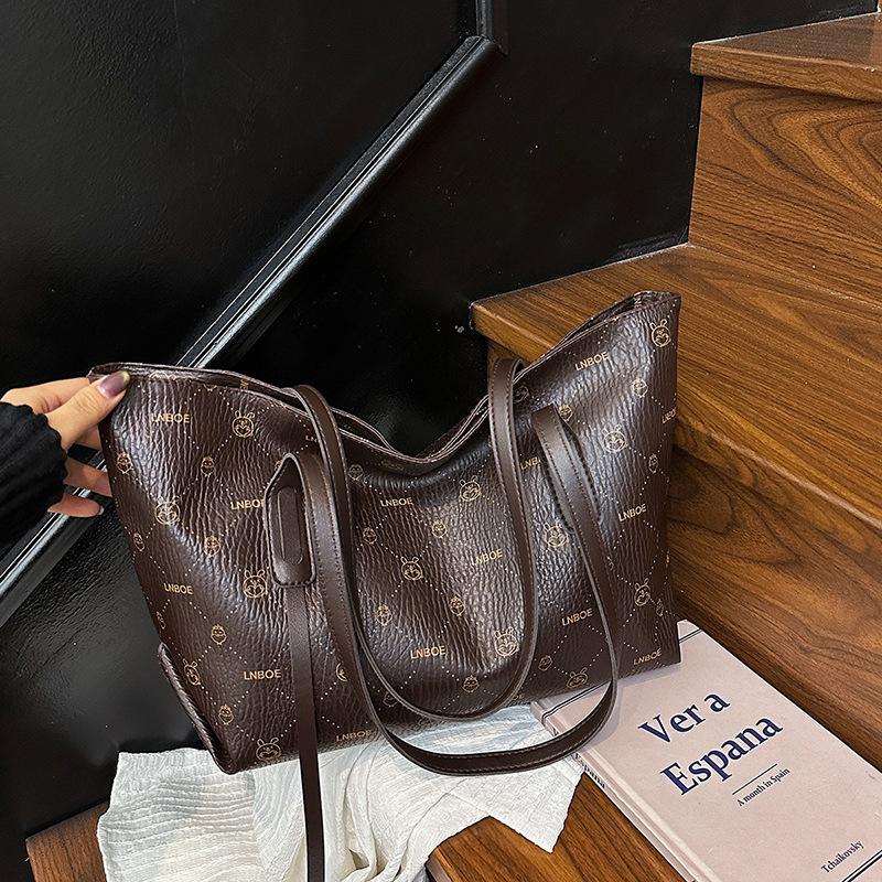 

2025 лето новая модная сумка большой вместимости повседневная простая сумка-тоут высокая ценность однотонная высокая ценность женская сумка