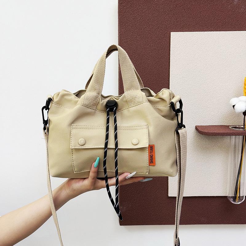 

Korean version of foreign style drawstring women s shoulder bag casual and lightweight portable small square bag to work commuting going out trav хакі