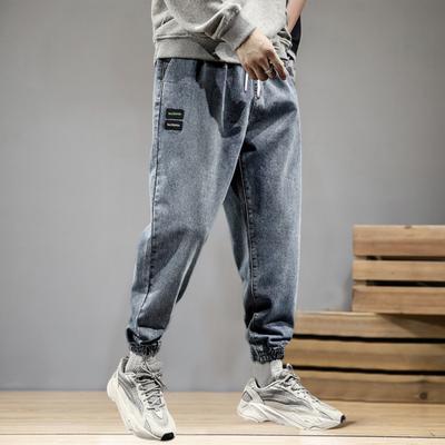Elastyczny pas ze średnim stanem sznurkiem termokurczliwe mankiety dżinsy męskie wiele kieszeni hiphopowe dżinsowe spodnie do joggingu Streetwear