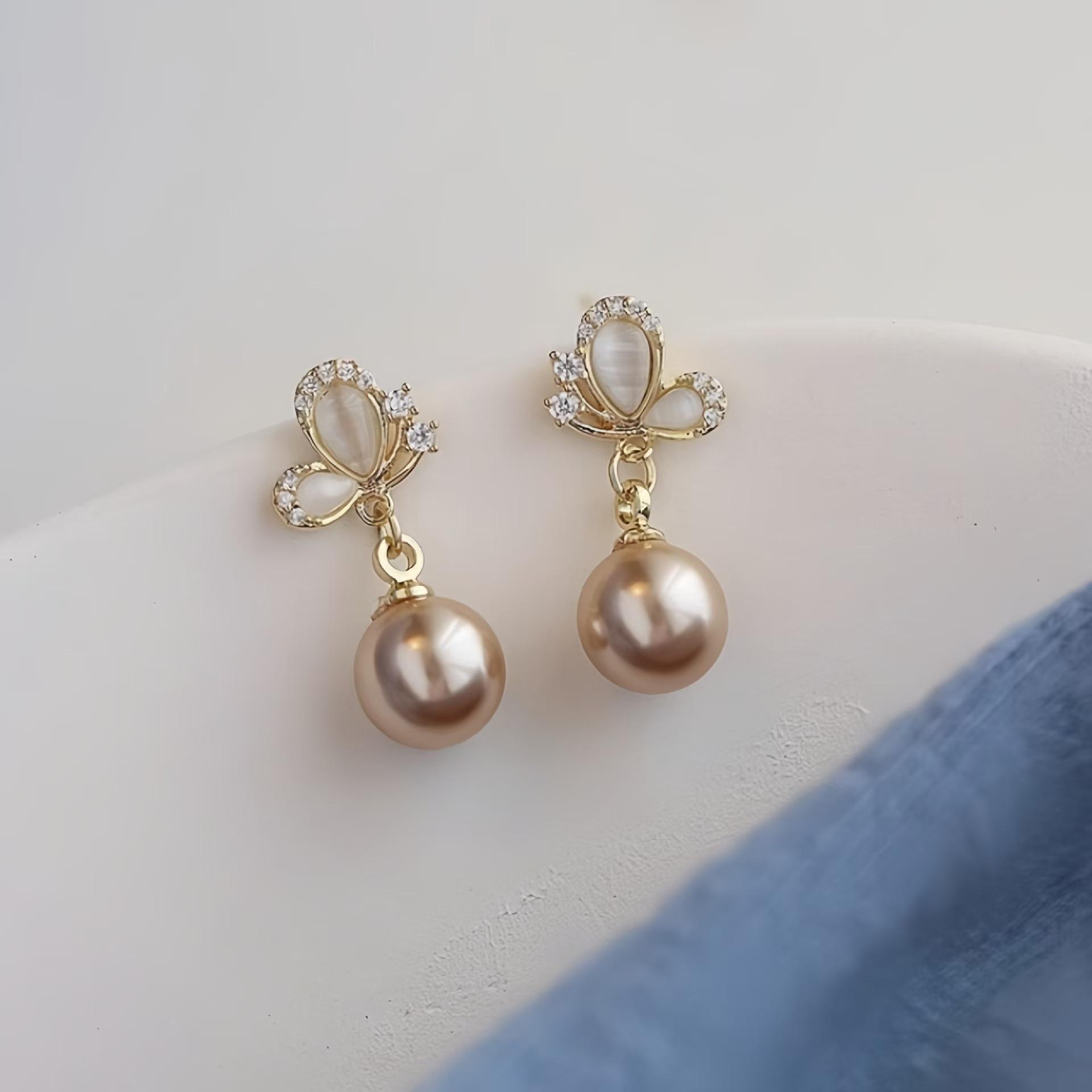 

Premium champagne gold pearl stud earrings s niche design exquisite temperament opal butterfly earrings шампанского
